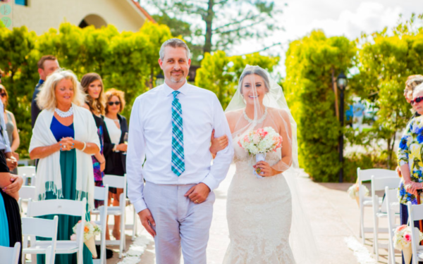 Bride and father walking down the aisle