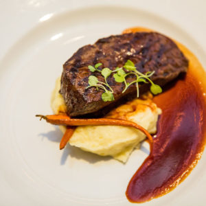 steak with mashed potatoes and grilled carrots