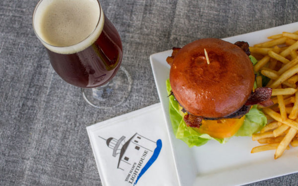 a beer with a burger and fries