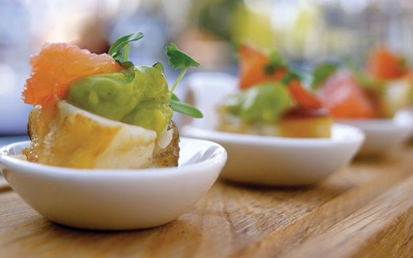 Seafood with avocado puree in bowls