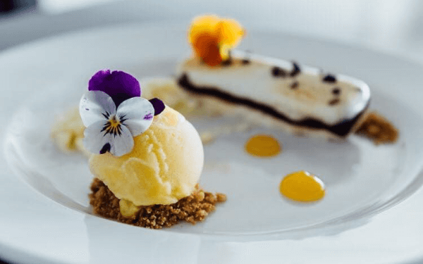 Dessert with ice cream decorated with flowers