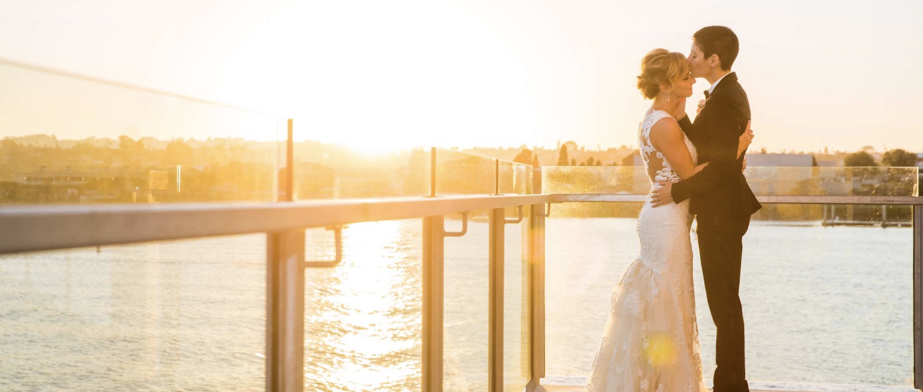 a couple kissing on their wedding day